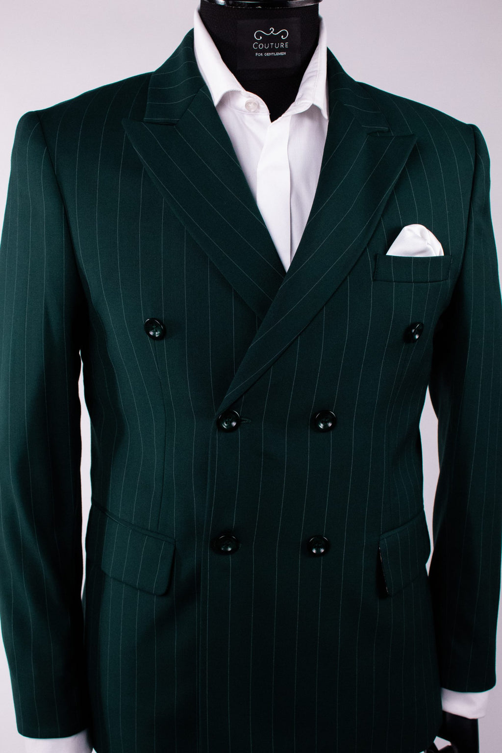 Dark green men's costume jacket with double-breasted buttons, tailored fit, featuring vertical stripe pattern and structured lapels.