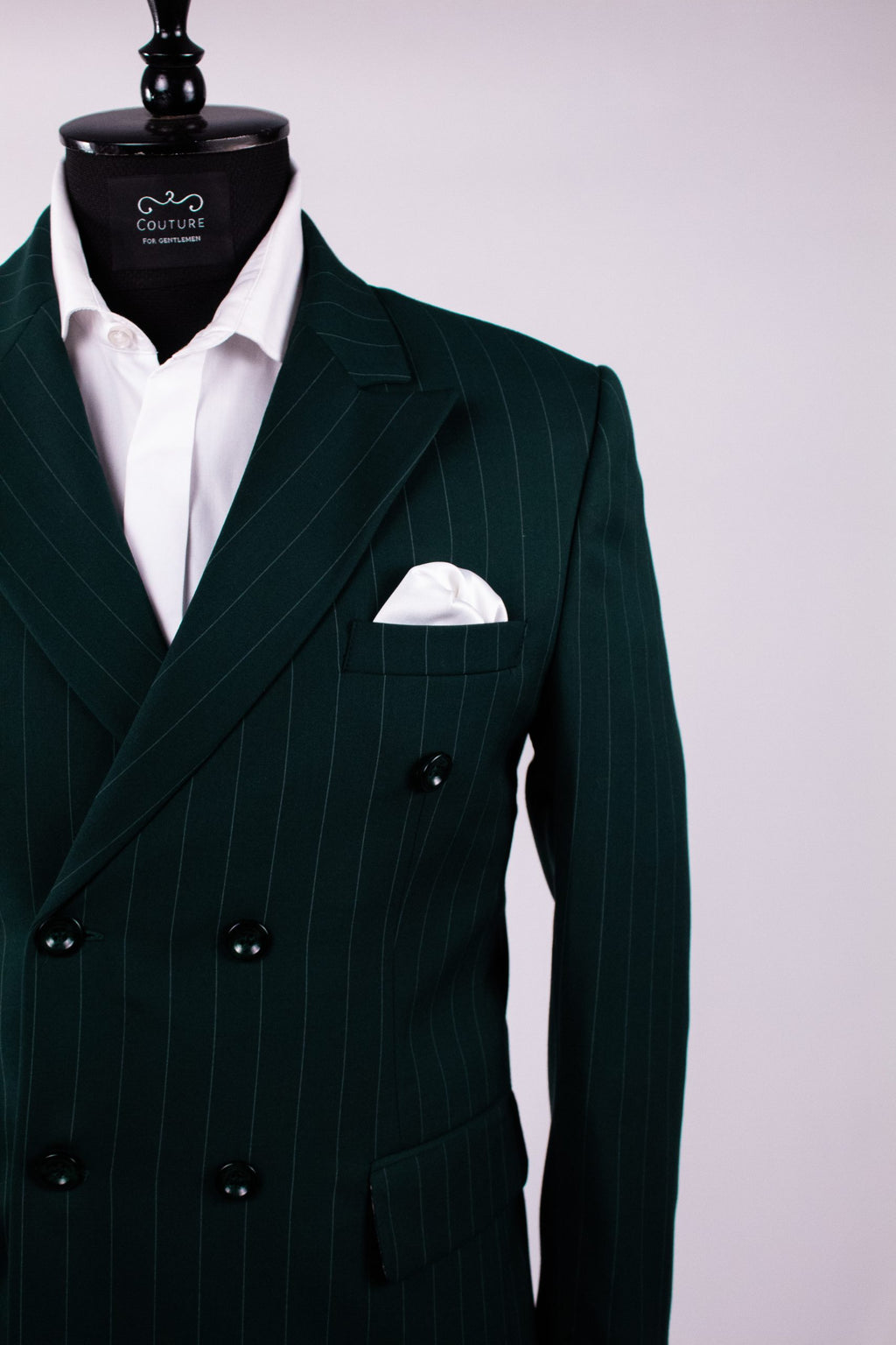 Dark green men's costume jacket with double row buttons, tailored fit, featuring vertical stripe pattern and classic design.