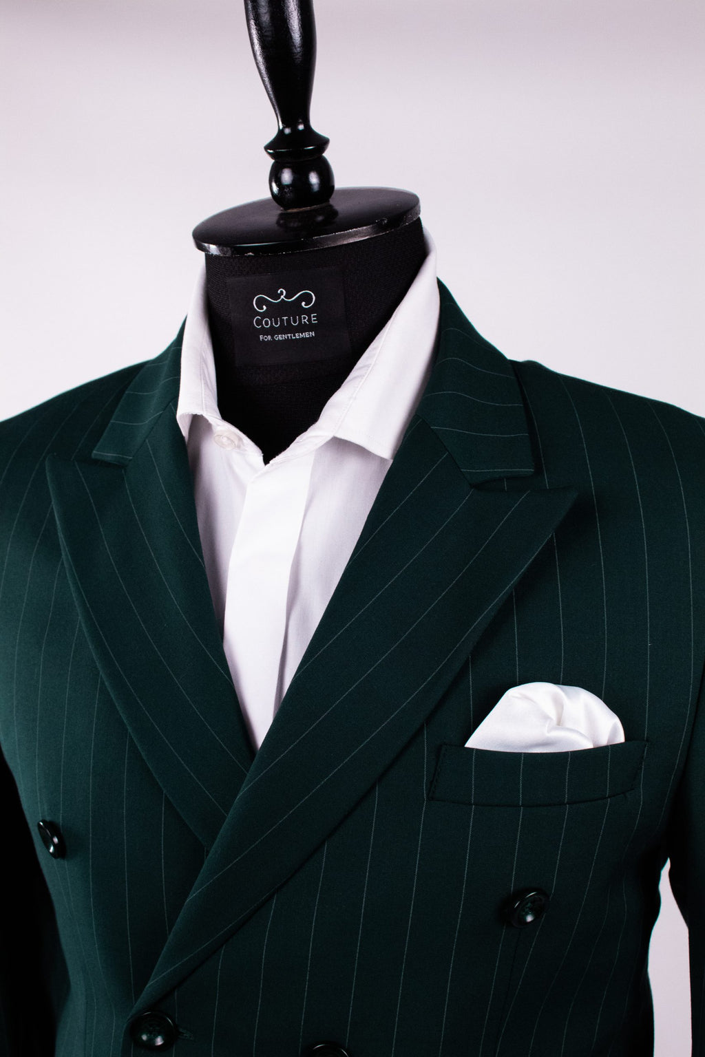 Dark green men's costume jacket with double row of buttons, tailored fit, featuring vertical stripe pattern and classic collar.